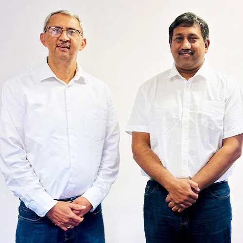 Team photo - two men in white shirts